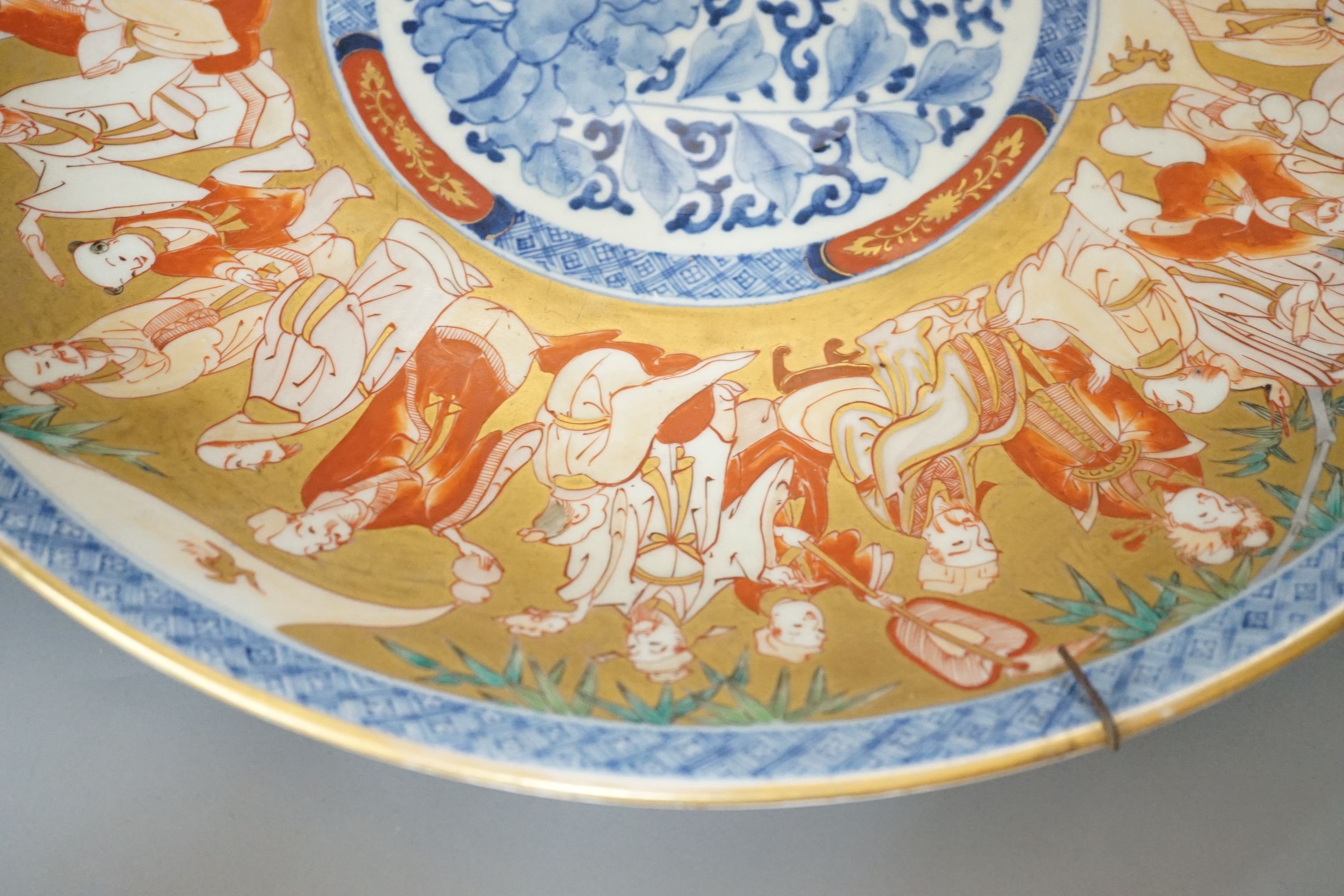 A large Japanese Imari ‘immortals’ dish - 46cm diameter